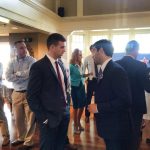 Hampden District Attorney Anthony Gulluni talks to a person at an event.