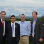 Hampden District Attorney Anthony Gulluni poses for a photo with three other people.