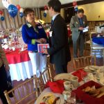 Hampden District Attorney Anthony Gulluni talks with a person at an event.