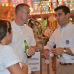 Hampden District Attorney Anthony Gulluni talks to two people.