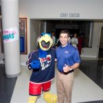 Hampden District Attorney Anthony Gulluni poses with a sports team mascot.