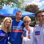 Hampden District Attorney Anthony Gulluni poses with three people.