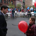 Hampden District Attorney Anthony Gulluni talks to a young girl during a campaign stop.