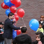 Hampden District Attorney Anthony Gulluni giving out balloons.