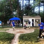 Someone steps up to home plate during a wiffle ball tournament.