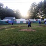 A wiffle ball game taking place.