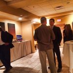 Hampden District Attorney Anthony Gulluni talks to a person at a campaign event.