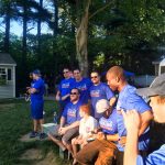 A wiffle ball team smile for a photo.