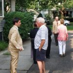 Hampden District Attorney Anthony Gulluni talks with a person outside.