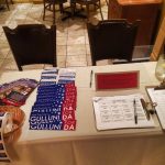 A table filled with campaign materials for Hampden District Attorney Anthony Gulluni.