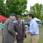 Hampden District Attorney Anthony Gulluni talks with two people.