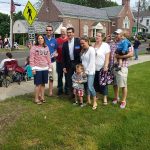 Hampden District Attorney Anthony Gulluni poses for a photo with a group of people.