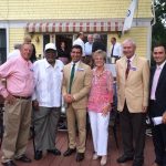 Hampden District Attorney Anthony Gulluni smiles and poses for a photo with five others.