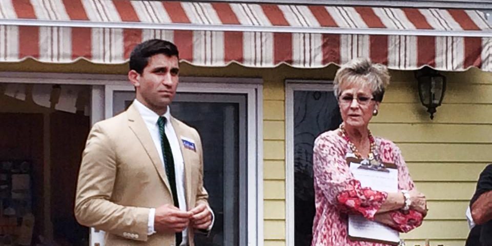 Hampden District Attorney Anthony Gulluni and another woman stand at an event.