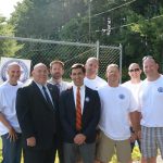 Hampden District Attorney Anthony Gulluni poses for a photo with a group of people.