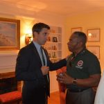 Hampden District Attorney Anthony Gulluni talks to a person at an event.