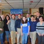 Hampden District Attorney Anthony Gulluni poses with a group of people at a campaign event.