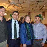 Hampden District Attorney Anthony Gulluni poses for a photo with three other people.