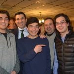 Hampden District Attorney Anthony Gulluni poses for a photo with four people.