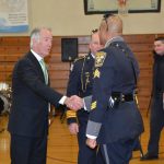 U.S. Rep. Richard Neal shakes hands with a member of the sheriff's department.