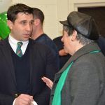 Hampden District Attorney Anthony Gulluni talks to a person at an event.