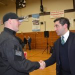 Hampden District Attorney Anthony Gulluni shakes hands with a person.