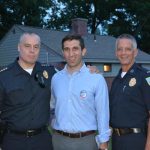 Hampden District Attorney Anthony Gulluni poses for a photo with two first responders.