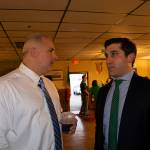 Hampden District Attorney Anthony Gulluni and another man speak at an event.