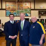 Hampden District Attorney Anthony Gulluni, Hampden Sheriff Nicholas Cocchi and U.S. Rep. Richard Neal smile and pose for a photo.