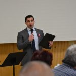 Hampden District Attorney Anthony Gulluni speaks to a group of people.